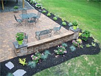 Patio With Sitting Wall and Flowerbed